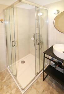 a bathroom with a shower and a sink at Falcon Apartment Center 2 Metro Złote Tarasy in Warsaw