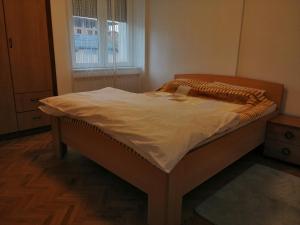 Кровать или кровати в номере STE-FI APARTMANS