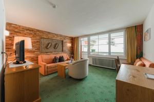 Posedenie v ubytovaní Hotel Schwarzer Adler - Sport & Spa