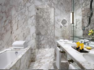 a bathroom with a tub and a sink and a shower at The Gritti Palace, a Luxury Collection Hotel, Venice in Venice