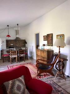 a living room with a couch and a table at Amazing 4-Bed Cottage lost in Montseny Nature in Arbúcies