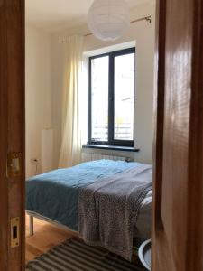 a bedroom with a bed and a window at Cozy house in Gyumri