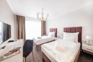 Katil atau katil-katil dalam bilik di Spa Hotel ULRIKA