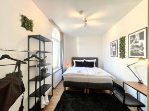 En eller flere senge i et værelse på Großes Apartment Bremerhaven