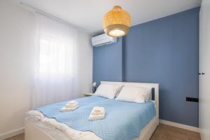 Postel nebo postele na pokoji v ubytování Kovač Family Suites