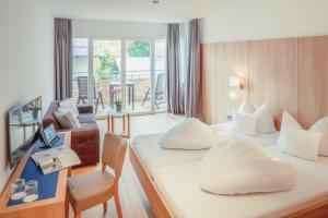Letto o letti in una camera di Hotel Kendler