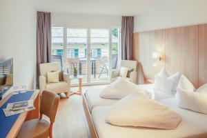 Letto o letti in una camera di Hotel Kendler
