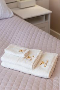 Postel nebo postele na pokoji v ubytování Kovač Family Suites