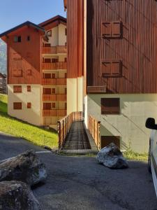 a building with a staircase next to some rocks at Emilie hanard in Saint-Jean-d'Aulps