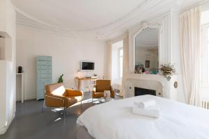 Postel nebo postele na pokoji v ubytování L'Hôtel Particulier - Appartements d'Hôtes
