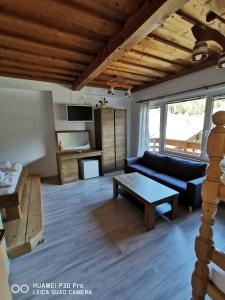 a living room with a couch and a table at Bed&Breakfast Anž'k in Bled