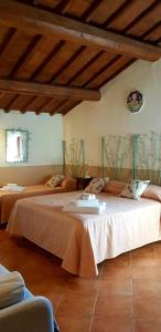 a bedroom with two beds in a room at Poggio al Sole in Fiesole