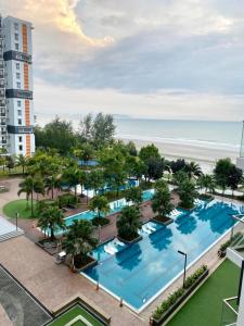 an aerial view of a resort with a large swimming pool at KUANTAN - TIMURBAY SEAFRONT RESIDENCE a in Kuantan