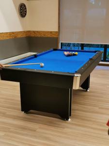 a pool table with balls on top of it at KUANTAN - TIMURBAY SEAFRONT RESIDENCE a in Kuantan