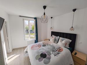 Posteľ alebo postele v izbe v ubytovaní Cosy Appartement T2 proche Paris