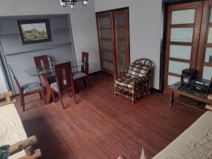 a living room with a dining room table and chairs at Hospedaje Casa Rojas in Bogotá