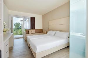 Postel nebo postele na pokoji v ubytování Hotel Royal Village