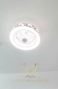 a white ceiling fan with a happy birthday margarita text at J&A Seaview Suites in Perai