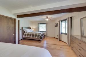 a bedroom with a bed and a window at McGaheysville Vacation Rental Yard and Fire Pit! in McGaheysville