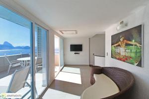 a living room with a view of the ocean at Beautiful 4BR duplex penthouse in Rio de Janeiro