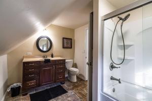 a bathroom with a sink and a toilet and a shower at Eagles Landing in La Crosse