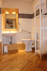 a bathroom with a sink and a toilet and a mirror at La Flèche D'Orres, 6 pers, 40m2, centre station in Les Orres