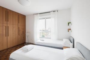 A bed or beds in a room at Easylife - Accogliente dimora con balcone