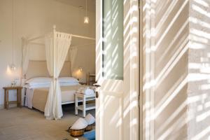 Ein Bett oder Betten in einem Zimmer der Unterkunft Masseria Rauccio