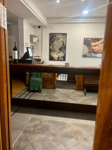 a view through a glass door of a room with a desk at Hostal Restaurante in Pamplona