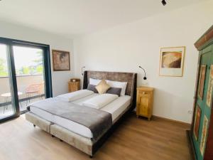 Ένα ή περισσότερα κρεβάτια σε δωμάτιο στο Hotel Garni Vinea Montis