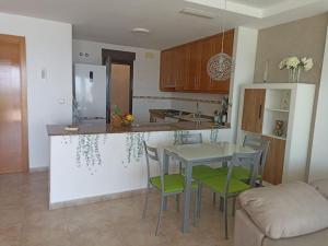 A kitchen or kitchenette at Bungalow en primera línea del mar