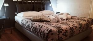Posteľ alebo postele v izbe v ubytovaní Villa Gelsomino Garden