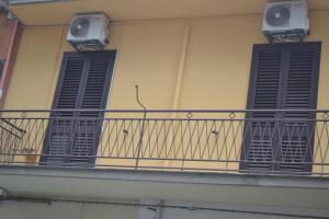 a balcony with two windows and two speakers on it at CASA CANNEZIO in Ragusa