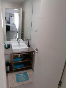 a bathroom with a sink and a mirror at Apartamento Viento Del Sur in Las Negras