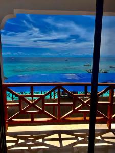 a view of the ocean from a balcony at Zenobia Beach Resort in Nungwi