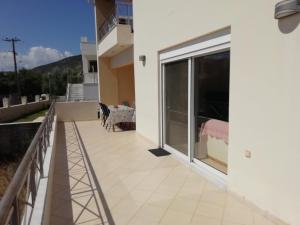 a balcony with a view of a bedroom at Rural 3-bedroom house Kalamata in Kalamata