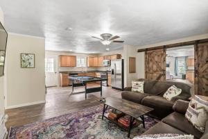 a living room with a couch and a table at Spacious Wine Country Retreat Close to Ithaca in Lansing