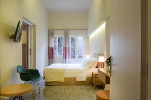 Postel nebo postele na pokoji v ubytování Athena hotel