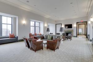 a large living room with couches and chairs at Fantastic 2 BR Condo At Pentagon City With Gym in Arlington