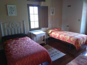Tempat tidur dalam kamar di Casa O Morao