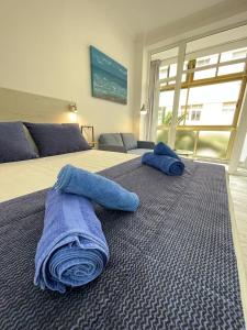 A bed or beds in a room at PALMERAS 102