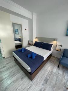 A bed or beds in a room at PALMERAS 102 Még 6 kép