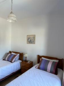 En eller flere senge i et værelse på Vila Mar Central + 11 billeder