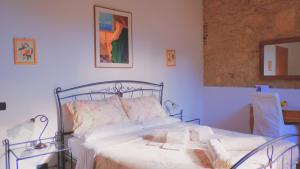 Posteľ alebo postele v izbe v ubytovaní B&B QUINTARELLI