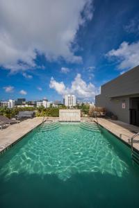 a swimming pool on the roof of a building at Moderno Residences By Bay Breeze in Miami Beach