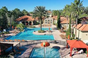 a view of a swimming pool at a resort at Apartment 3 BR in Tuscana Resort , 15" from Disney in Kissimmee