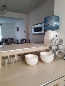 a kitchen with a counter with bowls on it at Loma Blanca in Libertador General San Martín