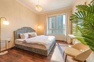 Ένα ή περισσότερα κρεβάτια σε δωμάτιο στο FIRST CLASS 3BR with full BURJ KHALIFA VIEW +34 φωτογραφίες