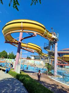 a water slide at a water park with people in it at Szafranzimmervermmitung in Winnenden