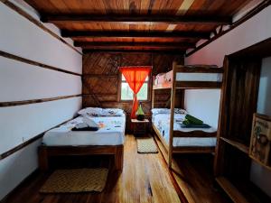Voodi või voodid majutusasutuse Hostal Olmito Canoa toas
